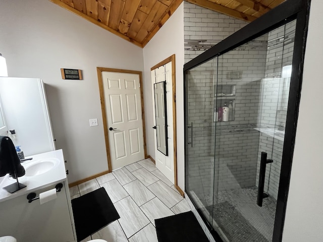 550 E N St, Edmore, MI 48829 - full bath featuring wood ceiling, lofted ceiling, a shower stall, vanity, and baseboards