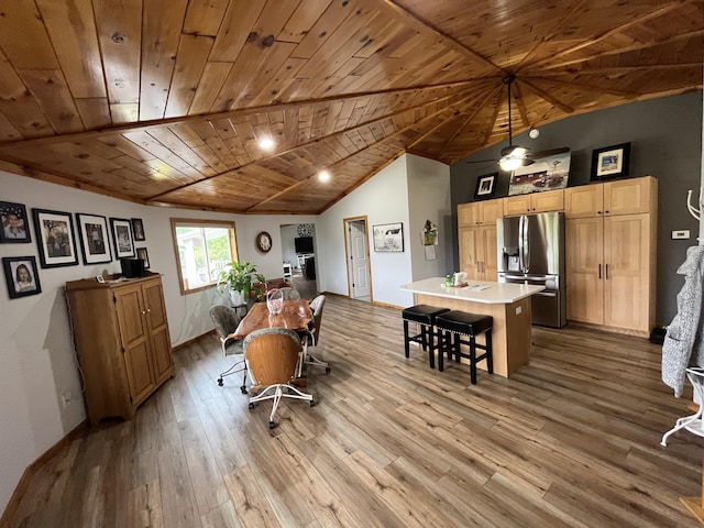 550 E N St, Edmore, MI 48829 - dining area with wooden ceiling, wood-type flooring, high vaulted ceiling, and baseboards