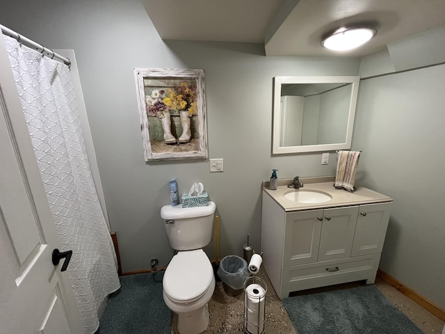 550 E N St, Edmore, MI 48829 - bathroom with vanity, baseboards, toilet, and curtained shower