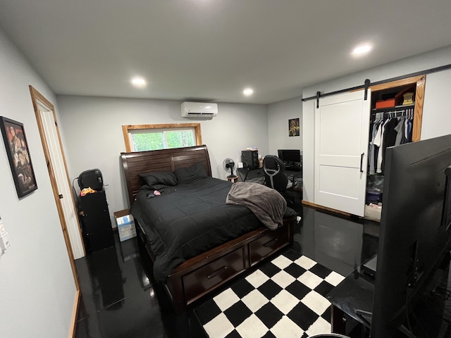550 E N St, Edmore, MI 48829 - bedroom featuring a wall mounted AC, a barn door, recessed lighting, and tile patterned floors