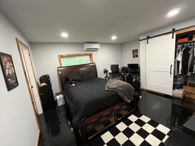 550 E N St, Edmore, MI 48829 - bedroom with an AC wall unit, recessed lighting, and a barn door