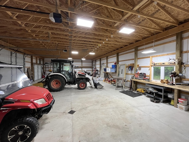 550 E N St, Edmore, MI 48829 - garage featuring a garage door opener and a workshop area