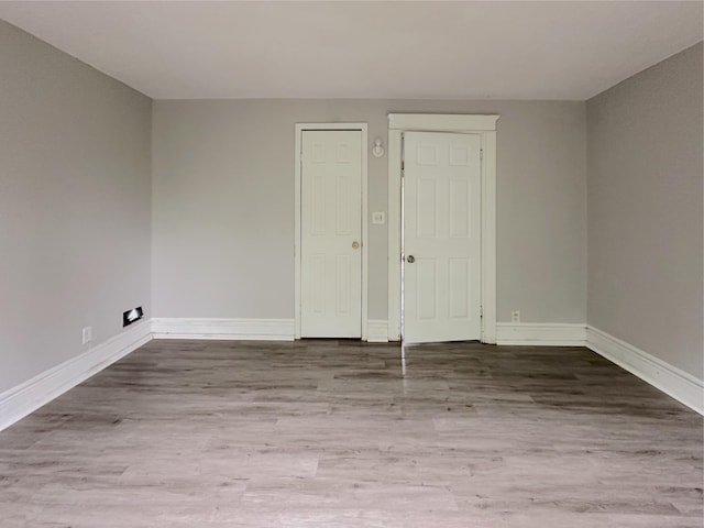 93 Goguac St E, Battle Creek, MI 49015 - empty room featuring wood finished floors and baseboards