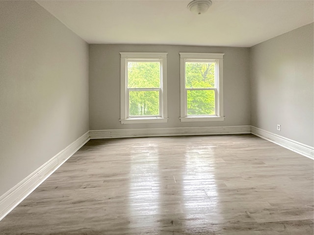 93 Goguac St E, Battle Creek, MI 49015 - unfurnished room featuring baseboards and wood finished floors