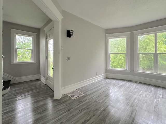 93 Goguac St E, Battle Creek, MI 49015 - empty room featuring baseboards and wood finished floors