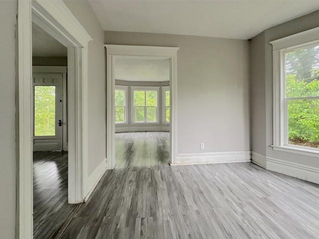93 Goguac St E, Battle Creek, MI 49015 - empty room with wood finished floors and baseboards
