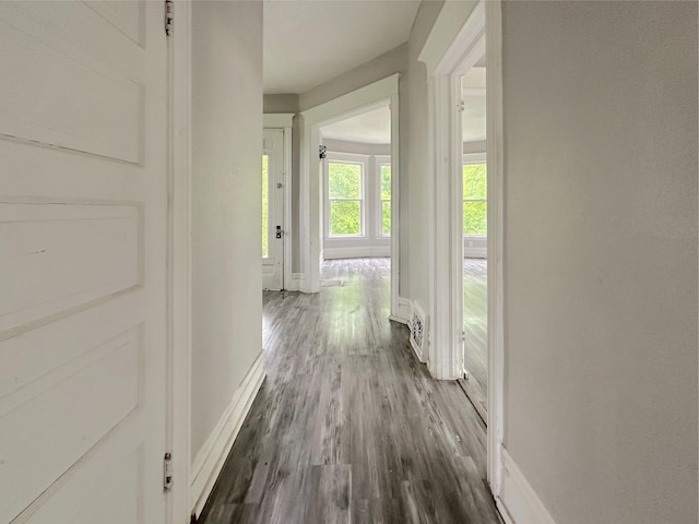 93 Goguac St E, Battle Creek, MI 49015 - hall featuring baseboards and dark wood-type flooring
