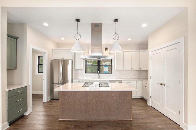 0 Baldwin St, Hudsonville, MI 49426 - kitchen with appliances with stainless steel finishes, island range hood, backsplash, light countertops, and recessed lighting