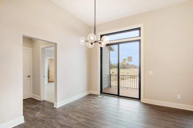0 Baldwin St, Hudsonville, MI 49426 - spare room with a chandelier, dark wood-style flooring, and baseboards