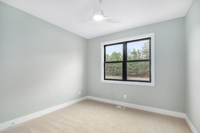 0 Baldwin St, Hudsonville, MI 49426 - unfurnished room featuring light colored carpet, baseboards, and ceiling fan