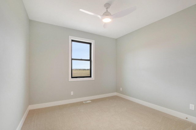 0 Baldwin St, Hudsonville, MI 49426 - spare room with light colored carpet, baseboards, and a ceiling fan