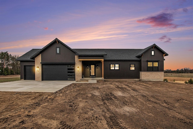 0 Baldwin St, Hudsonville, MI 49426 - modern farmhouse style home with driveway, roof with shingles, and a garage