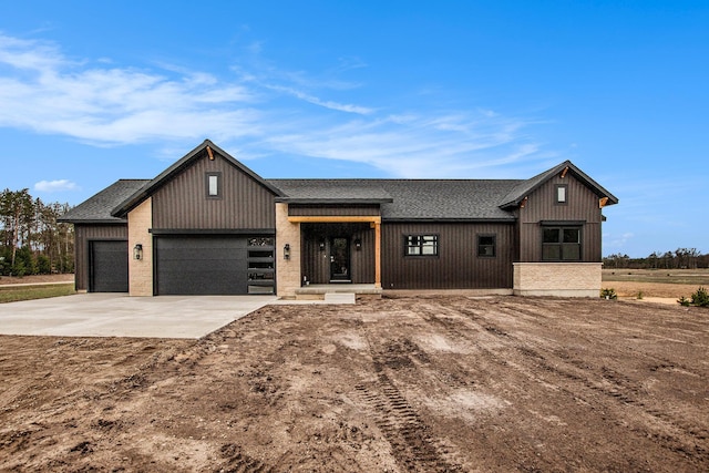 0 Baldwin St, Hudsonville, MI 49426 - modern inspired farmhouse featuring a shingled roof, a garage, and driveway