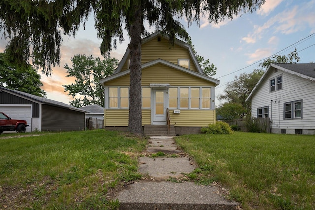 2218 Dalton Ave SW, Wyoming, MI 49519 - view of front facade featuring entry steps, a garage, and a yard