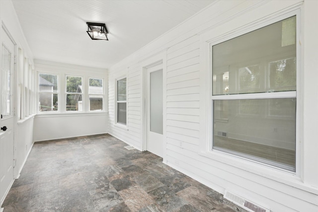 2218 Dalton Ave SW, Wyoming, MI 49519 - unfurnished sunroom featuring stone finish floors