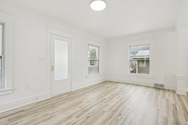 2218 Dalton Ave SW, Wyoming, MI 49519 - empty room featuring plenty of natural light and wood finished floors