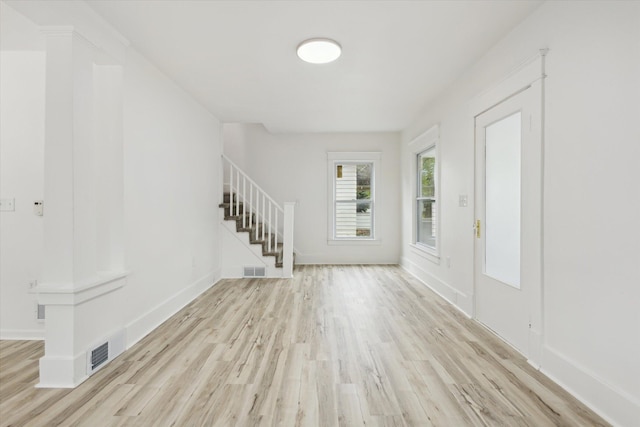 2218 Dalton Ave SW, Wyoming, MI 49519 - foyer entrance with stairway, wood finished floors, and baseboards