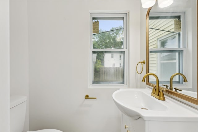 2218 Dalton Ave SW, Wyoming, MI 49519 - half bathroom with vanity and toilet