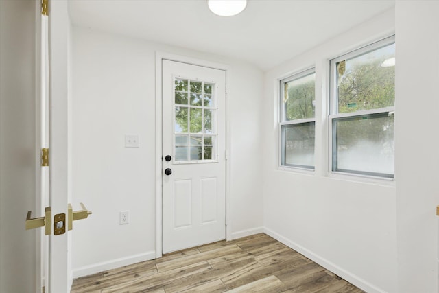 2218 Dalton Ave SW, Wyoming, MI 49519 - entryway featuring light wood-type flooring and baseboards