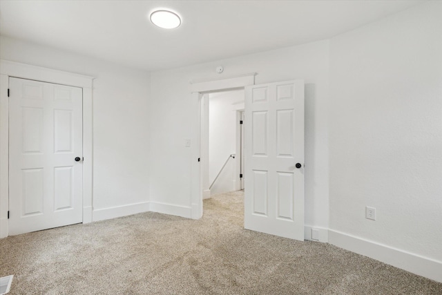 2218 Dalton Ave SW, Wyoming, MI 49519 - unfurnished bedroom with carpet floors and baseboards