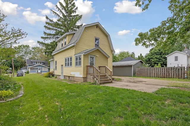 2218 Dalton Ave SW, Wyoming, MI 49519 - rear view of property with a gambrel roof