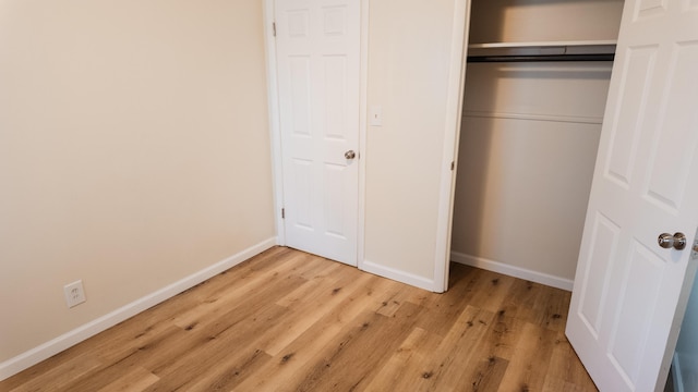 1514 Dean Dr, Albion, MI 49224 - unfurnished bedroom with baseboards, light wood-type flooring, and a closet