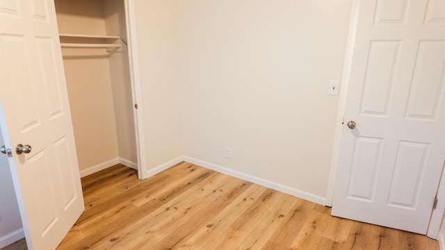 1514 Dean Dr, Albion, MI 49224 - unfurnished bedroom featuring baseboards, light wood-type flooring, and a closet
