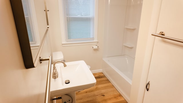 1514 Dean Dr, Albion, MI 49224 - bathroom with wood finished floors, a sink, and  shower combination