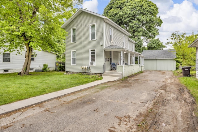 837 Backus St, Jackson, MI 49202 - view of front of property with covered porch, driveway, and a front yard