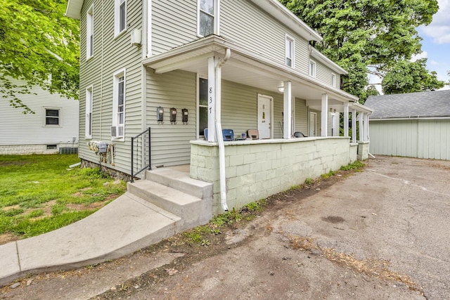 837 Backus St, Jackson, MI 49202 - view of front of home with covered porch and central AC