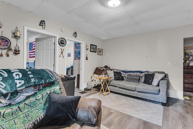 837 Backus St, Jackson, MI 49202 - living area with a paneled ceiling and wood finished floors