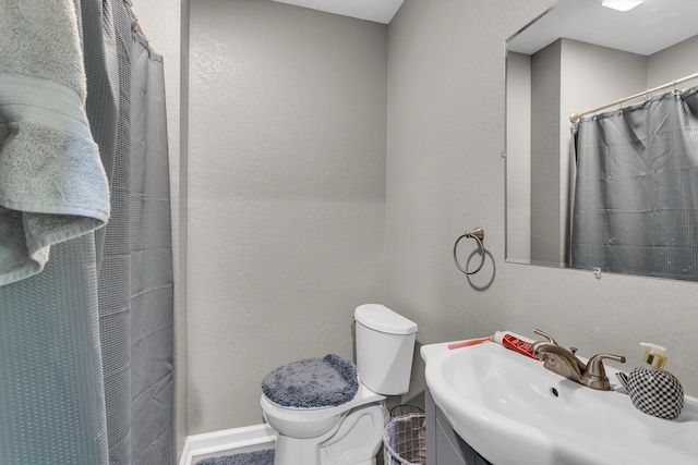 837 Backus St, Jackson, MI 49202 - bathroom with toilet, vanity, baseboards, and curtained shower