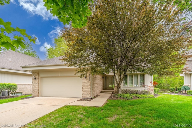 6560 Pleasant Lake Ct Unit 11, West Bloomfield, MI 48322 - view of front of house with brick siding, an attached garage, driveway, and a front lawn