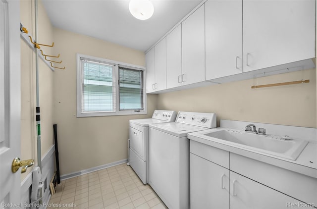 6560 Pleasant Lake Ct Unit 11, West Bloomfield, MI 48322 - laundry area with washing machine and clothes dryer, cabinet space, and baseboards