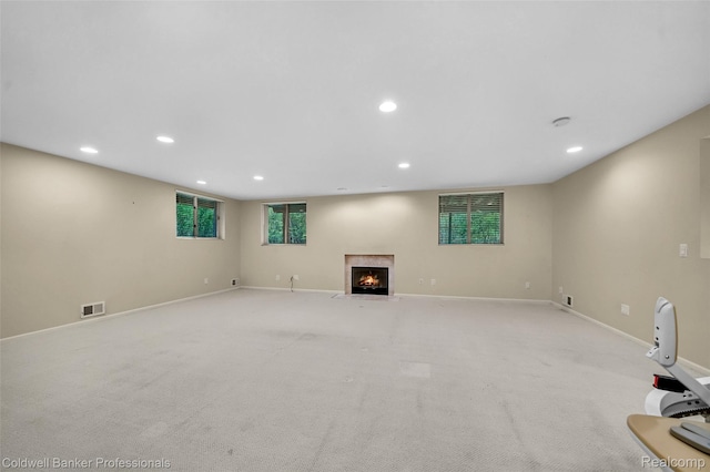 6560 Pleasant Lake Ct Unit 11, West Bloomfield, MI 48322 - unfurnished living room with recessed lighting, a fireplace with flush hearth, baseboards, and light carpet