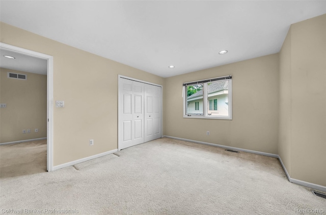 6560 Pleasant Lake Ct Unit 11, West Bloomfield, MI 48322 - unfurnished bedroom featuring carpet, baseboards, recessed lighting, and a closet