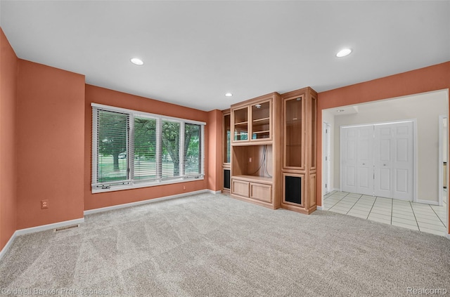 6560 Pleasant Lake Ct Unit 11, West Bloomfield, MI 48322 - unfurnished living room with light colored carpet, baseboards, recessed lighting, and light tile patterned floors