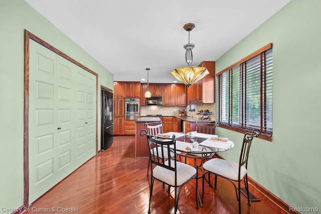 24018 Glen Ridge Ct, Novi, MI 48375 - dining space featuring wood finished floors and baseboards