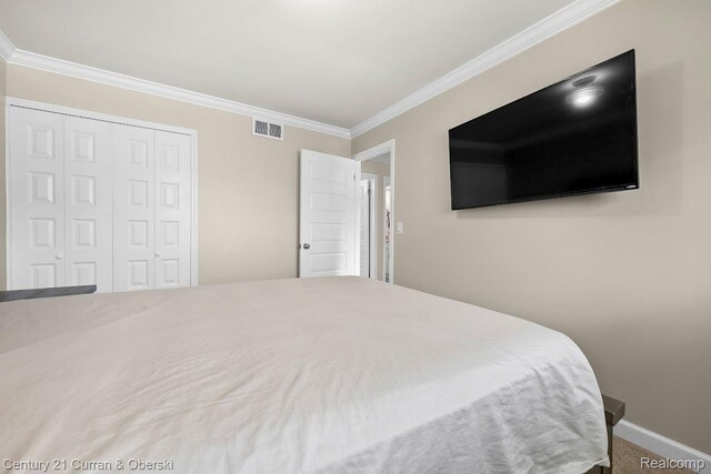 24018 Glen Ridge Ct, Novi, MI 48375 - bedroom with ornamental molding, a closet, and baseboards