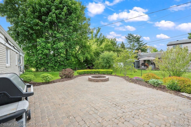 24018 Glen Ridge Ct, Novi, MI 48375 - view of patio with an outdoor fire pit and grilling area