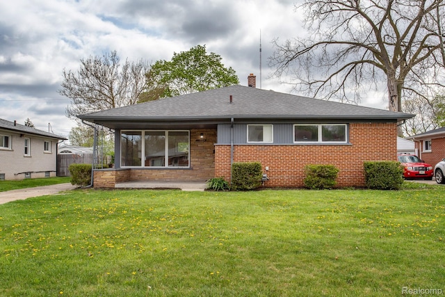 24548 Templar Ave, Southfield, MI 48075 - rear view of property featuring brick siding, a chimney, and roof with shingles