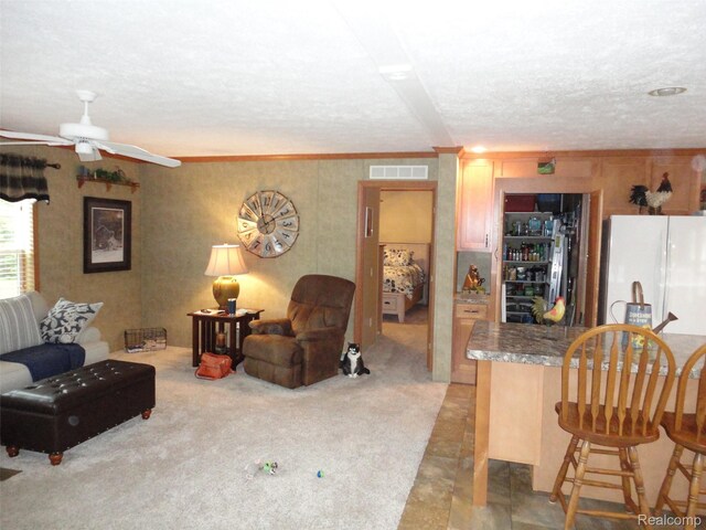 501 Kinloch, Temperance, MI 48182 - living room with a textured ceiling, ornamental molding, ceiling fan, and bar