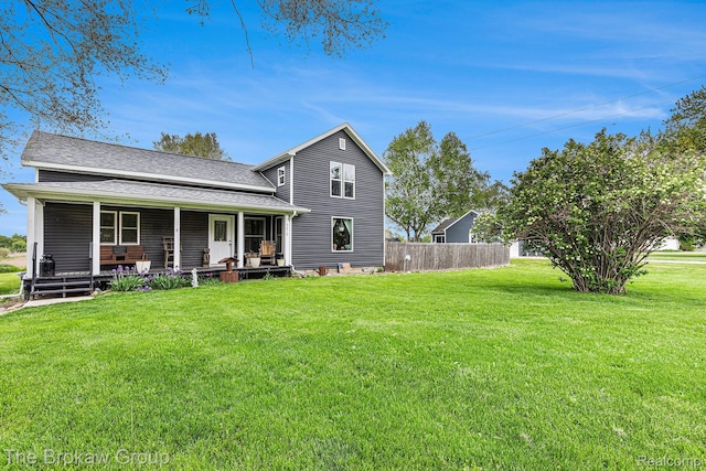 4470 Beach St, Akron, MI 48701 - rear view of property featuring covered porch and a shingled roof