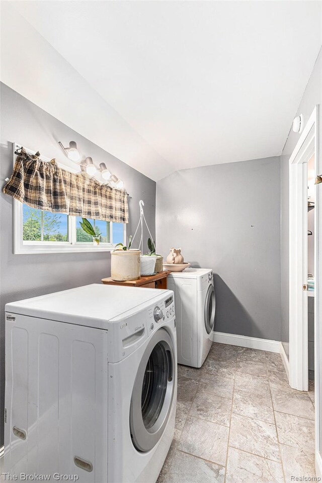 4470 Beach St, Akron, MI 48701 - laundry room featuring washer and dryer, baseboards, and light stone finish flooring