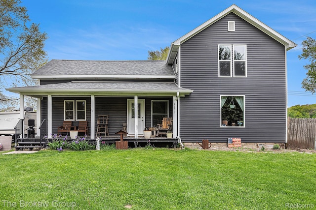 4470 Beach St, Akron, MI 48701 - back of house with a shingled roof and a porch