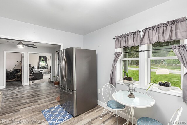 4470 Beach St, Akron, MI 48701 - dining room featuring wood finished floors, ceiling fan, and baseboards