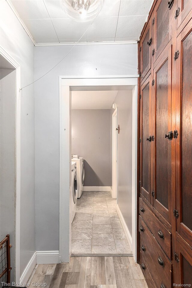 4470 Beach St, Akron, MI 48701 - corridor featuring washer and dryer, baseboards, and light wood-style floors