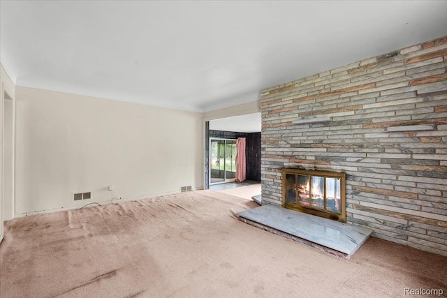 3301 S Kearsley Blvd, Flint, MI 48506 - unfurnished living room featuring carpet flooring and a stone fireplace