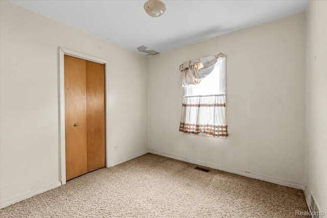 3301 S Kearsley Blvd, Flint, MI 48506 - spare room with carpet flooring
