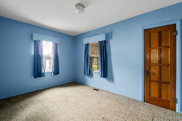 3301 S Kearsley Blvd, Flint, MI 48506 - carpeted empty room with baseboards